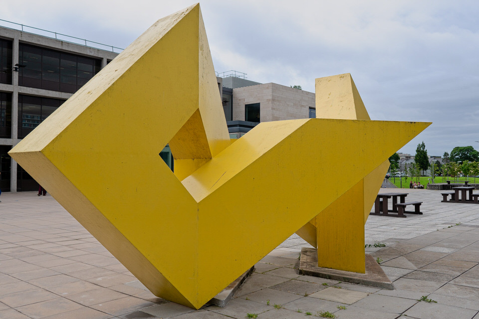 A Big Yellow Metal Sculpture By Brian King