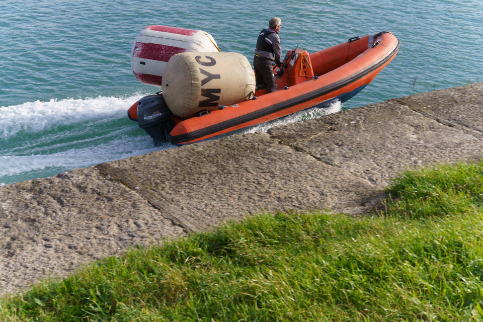 Man And His Two Buoys In A RIB